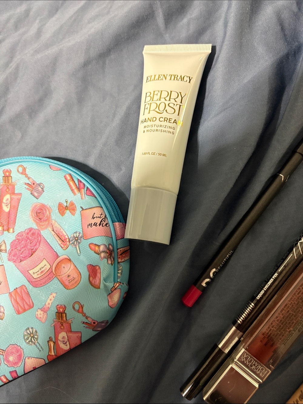 Blue Cosmetic Makeup Bag with Fun Print and assorted make up. - Picture 6 of 16